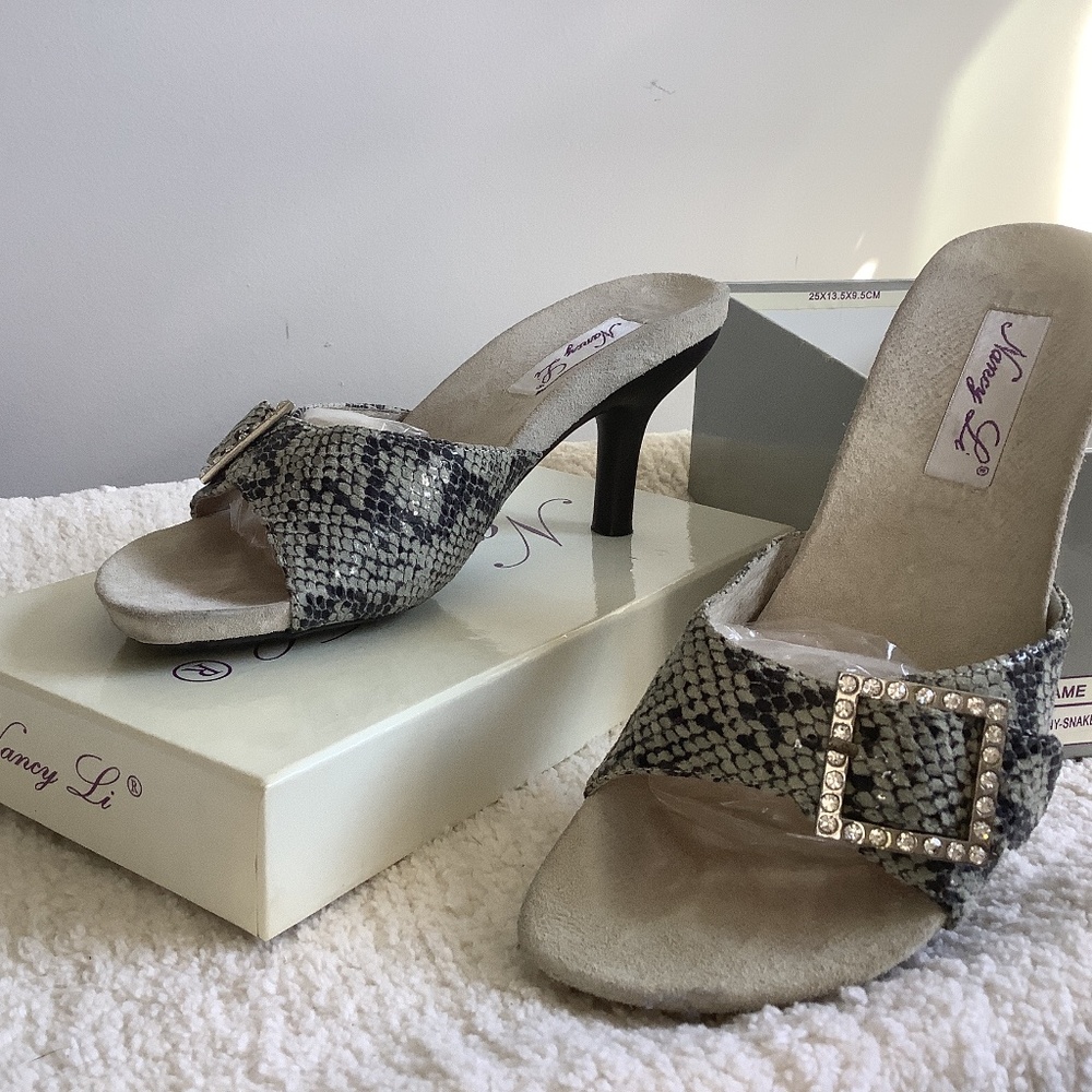 Snakeskin kitten heel slides with rhinestone buckless